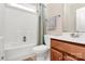 Functional bathroom with bathtub and shower combination with muted accents at 7925 Woodmere Dr, Harrisburg, NC 28075