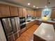 Spacious kitchen with stainless steel appliances and wood floors at 7925 Woodmere Dr, Harrisburg, NC 28075