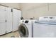 Efficient laundry room with modern washer and dryer, plenty of storage space at 7925 Woodmere Dr, Harrisburg, NC 28075