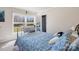 Bright bedroom with a large window and patterned bedding at 1912 Old West Ln, Gastonia, NC 28052