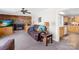 Cozy living room with brick fireplace, plush brown sofa and seamless flow into kitchen at 1912 Old West Ln, Gastonia, NC 28052