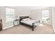 Comfortable bedroom with dark wood furnishings, and natural light at 2116 Wilson Ave, Monroe, NC 28110