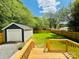 Spacious backyard features a wood deck, large grassy area, and detached garage for outdoor enjoyment at 417 Stonewall S Ave, Rock Hill, SC 29730