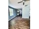 Bright living room with wood-look flooring, light blue walls and access to other rooms at 417 Stonewall S Ave, Rock Hill, SC 29730