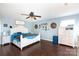 Bright bedroom with hardwood floors, a ceiling fan, and white furniture at 4519 S Potter Rd, Monroe, NC 28112