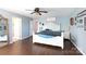 Light-filled bedroom features blue walls and natural hardwood flooring at 4519 S Potter Rd, Monroe, NC 28112