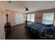 Bedroom with a ceiling fan, hard wood floors and large closed with 2 doors at 4519 S Potter Rd, Monroe, NC 28112