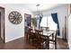 Elegant dining room features a wooden table set and a stylish light fixture at 4519 S Potter Rd, Monroe, NC 28112