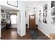 Inviting foyer with hardwood floors and stylish decor, leading to a home office and living spaces at 4519 S Potter Rd, Monroe, NC 28112