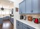 Charming kitchen showcasing blue cabinets, white countertops, and modern appliances at 4519 S Potter Rd, Monroe, NC 28112