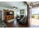 Open living room with a fireplace and seamless access to the outdoors at 4519 S Potter Rd, Monroe, NC 28112