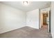 Neutral bedroom with closet and doorway, carpeted, and well-lit at 558 Dulaney Dr, Fort Mill, SC 29708
