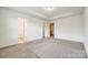 Bedroom features carpet flooring, neutral walls, and en suite access at 558 Dulaney Dr, Fort Mill, SC 29708
