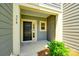 A welcoming front porch features house number, a black front door, and fresh green landscaping at 558 Dulaney Dr, Fort Mill, SC 29708