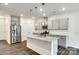 Modern kitchen with stainless steel appliances, granite countertops and island with pendant lighting at 558 Dulaney Dr, Fort Mill, SC 29708