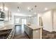 Open kitchen with granite countertops, stainless steel appliances, and an eat-in area with sliding glass doors at 558 Dulaney Dr, Fort Mill, SC 29708