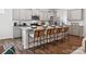 Modern kitchen featuring granite countertops, stainless steel appliances, and stylish bar stool seating at 1018 Mapletree Ln, Indian Trail, NC 28079