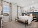 Serene main bedroom with neutral tones, natural light, and comfortable furnishings at 1018 Mapletree Ln, Indian Trail, NC 28079