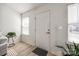 Bright entryway with hardwood floors and a large front door with glass peephole at 104 S Canyon Rdg, Mount Holly, NC 28120