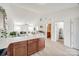 Open-concept kitchen with bar-top and a view of the dining and living areas featuring an open floor plan at 104 S Canyon Rdg, Mount Holly, NC 28120