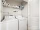 Laundry room equipped with a washer, a dryer, and shelving for storage with easy access and convenience at 104 S Canyon Rdg, Mount Holly, NC 28120