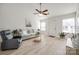 Cozy living room with ceiling fan, plush seating, and natural light at 104 S Canyon Rdg, Mount Holly, NC 28120