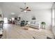 Open-concept living room with bright decor, sleek flooring, and modern fixtures at 104 S Canyon Rdg, Mount Holly, NC 28120