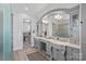 Elegant bathroom with double vanity, custom cabinetry, and walk in closet at 111 Moors End Loop, Mooresville, NC 28117