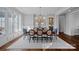 Elegant dining room with a chandelier, ample seating, and natural light. and built in cabinets at 111 Moors End Loop, Mooresville, NC 28117