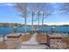 Stone walkway leading to a private dock with picturesque waterfront views at 111 Moors End Loop, Mooresville, NC 28117