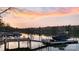 Waterfront property at sunset with private boat dock and serene water views at 111 Moors End Loop, Mooresville, NC 28117