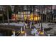 Stunning waterfront estate with private dock, sandy beach, and lush landscaping at twilight at 111 Moors End Loop, Mooresville, NC 28117