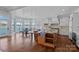 Spacious gourmet kitchen and dining area with large windows offering stunning waterfront views and a breakfast nook at 111 Moors End Loop, Mooresville, NC 28117