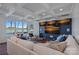 Comfortable living room with lake views, a large sectional sofa, and custom media display at 111 Moors End Loop, Mooresville, NC 28117