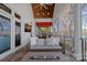 Outdoor living area with a fireplace and lake views, perfect for relaxing and entertaining at 111 Moors End Loop, Mooresville, NC 28117