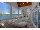 Stunning outdoor space with wicker furniture and lake views at 111 Moors End Loop, Mooresville, NC 28117