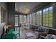 Inviting sunroom with large windows, providing lots of natural light and views of the surrounding landscape at 111 Moors End Loop, Mooresville, NC 28117