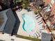 Overhead view of a kidney-shaped community pool with loungers and surrounding greenery at 1122 Dean Hall Ln, Matthews, NC 28105