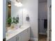 Bathroom with double sinks, a large mirror, and vanity with modern fixtures at 1122 Dean Hall Ln, Matthews, NC 28105