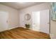 Spacious bonus room featuring hardwood floors, multiple doors, and natural light at 1122 Dean Hall Ln, Matthews, NC 28105