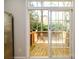 Wooden deck accessible via sliding glass doors, overlooking the outdoor area at 1122 Dean Hall Ln, Matthews, NC 28105