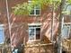 Elevated view of an apartment deck and its brick exterior with a partially obstructed view at 1122 Dean Hall Ln, Matthews, NC 28105