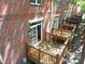 Aerial view of wooden decks offering outdoor space, attached to brick townhomes at 1122 Dean Hall Ln, Matthews, NC 28105