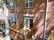 Upper-level view of a wood deck that is attached to a brick home, partially shaded by a tree at 1122 Dean Hall Ln, Matthews, NC 28105