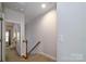 Bright hallway leading to bedroom with natural light and neutral tones at 1122 Dean Hall Ln, Matthews, NC 28105