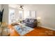 Comfortable living room showcasing hardwood floors, neutral tones, and natural light at 1122 Dean Hall Ln, Matthews, NC 28105