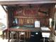 Outdoor bar complete with sink, lighting, and mini refrigerator at 113 Larboard Trl # B36/37, Mount Gilead, NC 27306