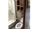 Bathroom featuring shower, toilet, and small storage shelving at 113 Larboard Trl # B36/37, Mount Gilead, NC 27306