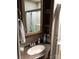 Bathroom featuring sink, vanity, mirror, and storage shelves at 113 Larboard Trl # B36/37, Mount Gilead, NC 27306