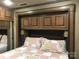 Comfortable main bedroom with bed, overhead storage, and decorative pillows at 113 Larboard Trl # B36/37, Mount Gilead, NC 27306